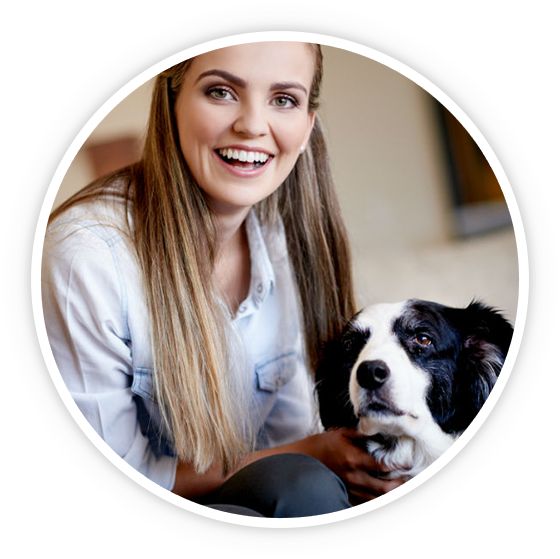 Happy groomer with dog